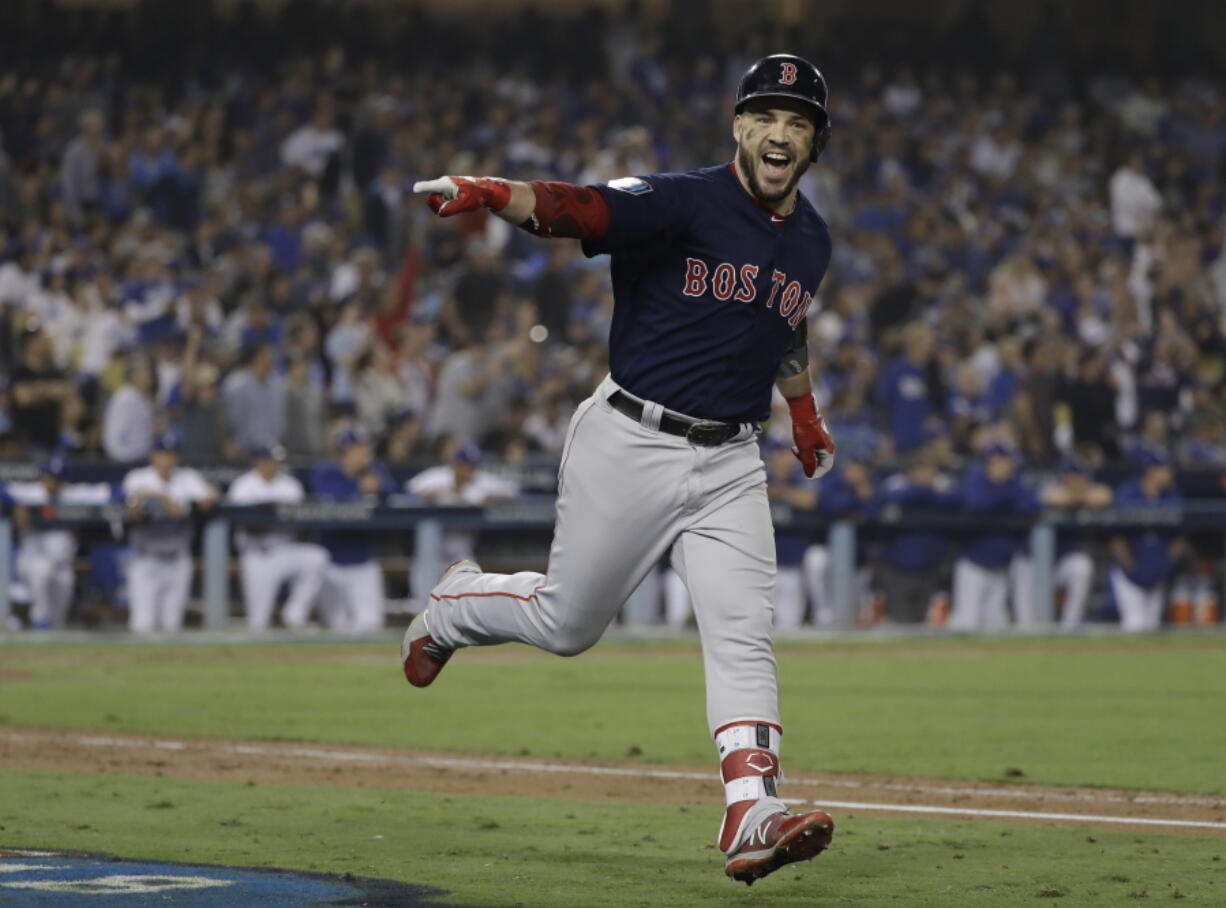 Boston Red Sox’s Steve Pearce celebrates his second home run during the eighth inning in Game 5 of the World Series baseball game against the Los Angeles Dodgers on Sunday, Oct. 28, 2018, in Los Angeles. (AP Photo/David J.