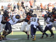 Oregon State quarterback Jack Colletto throws a pass during the second half of an NCAA college football game against California in Corvallis, Ore., Saturday, Oct. 20, 2018.