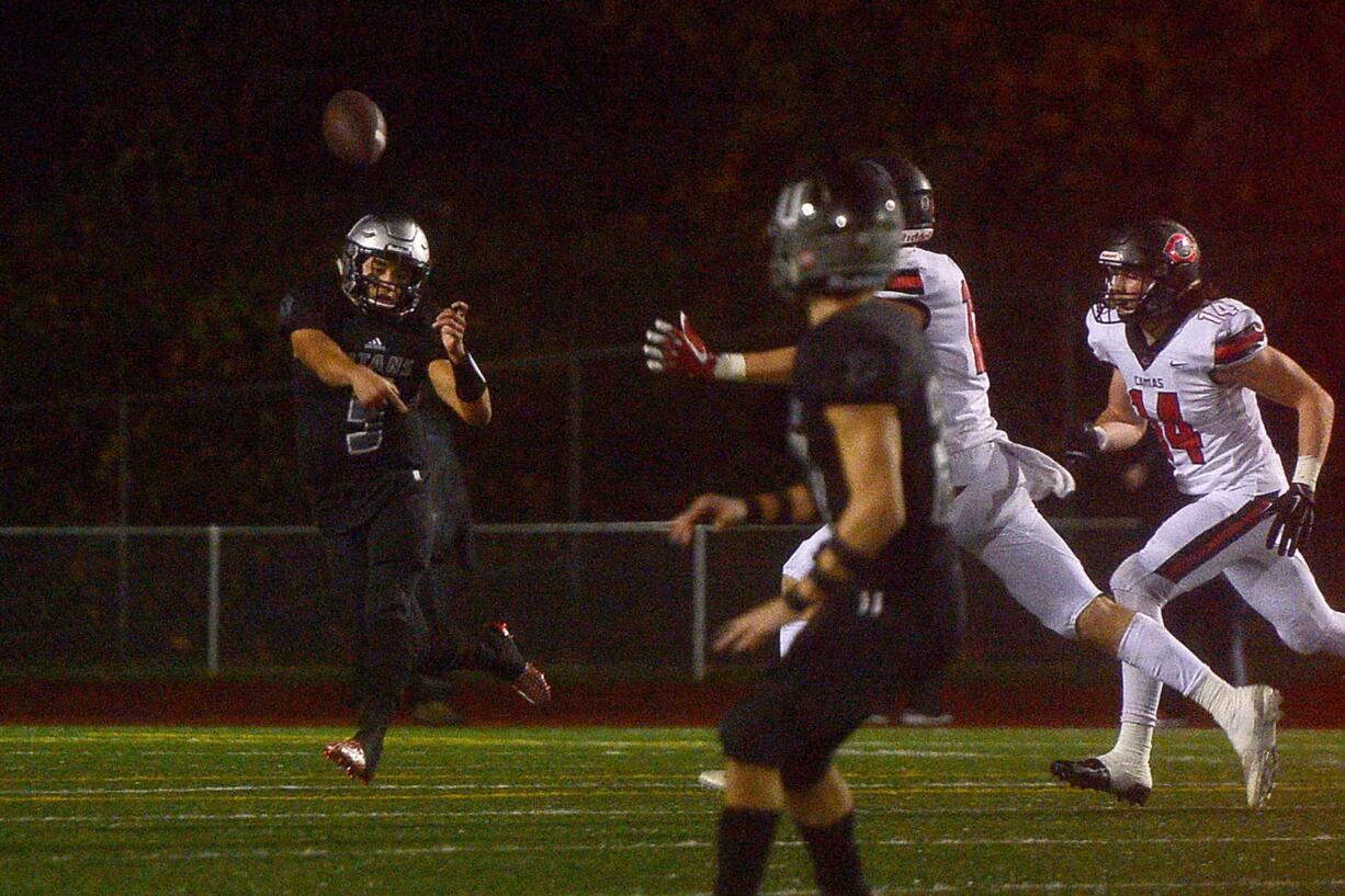 Union quarterback Lincoln Victor gets a pass off to receiver Alex Vallejo during a game against Camas at McKenzie Stadium in Vancouver on Friday, October 26, 2018. Union beat Camas 14-7.