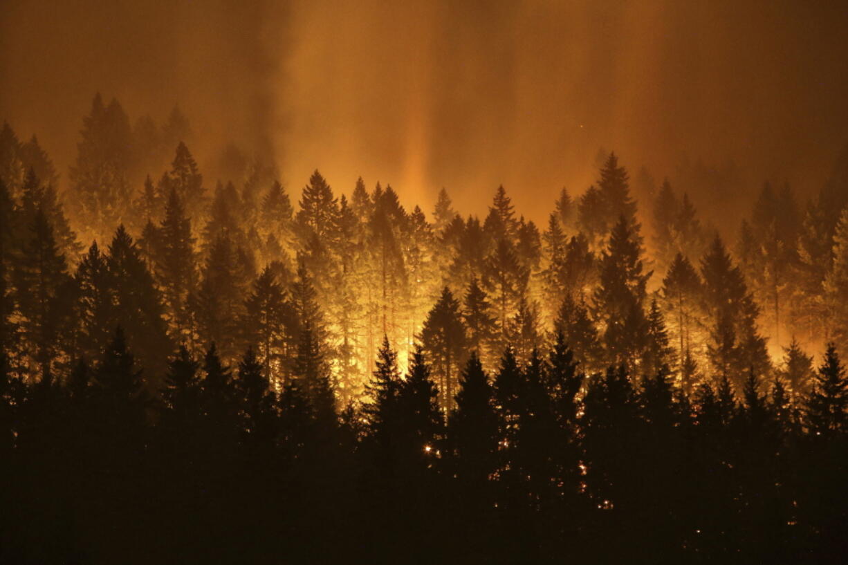 The Eagle Creek wildfire burns on the Oregon side of the Columbia River Gorge near Cascade Locks, Ore., on Sept. 5, 2017.