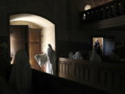 French tourists visit the church of Saint George in the village of Lukava, Czech Republic. In the year of 2012 the art student Jakub Hadrava filled the church’s pews with ghostly figures, made from plaster casts of live models draped in white cloth. The effect is chilling.