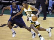 From 2008, Seattle SuperSonics' Kevin Durant (35) tries to drive past Dallas Mavericks' Josh Howard during an NBA game at KeyArena in Seattle. KeyArena is getting an appropriate send off Friday, Oct. 5, 2018, with an NBA game being played once again under its roof as the former home of the SuperSonics will see the Golden State Warriors meet the Sacramento Kings in a preseason game. Afterward, the building will be shuttered and remodeled.