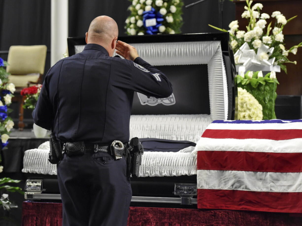 Mourners and police officers from around the country attend a memorial service before the funeral for fallen Florence police officer Sgt. Terrence Carraway on Monday at the Florence Center in Florence, S.C. Sgt. Carraway was killed in the line of duty Wednesday, Oct. 3, 2018.