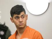 Erick Garcia-Valdovinos, 18, makes a first appearance Monday morning in Clark County Superior Court after being arrested on suspicion of two counts of first-degree kidnapping and one count of first-degree robbery.