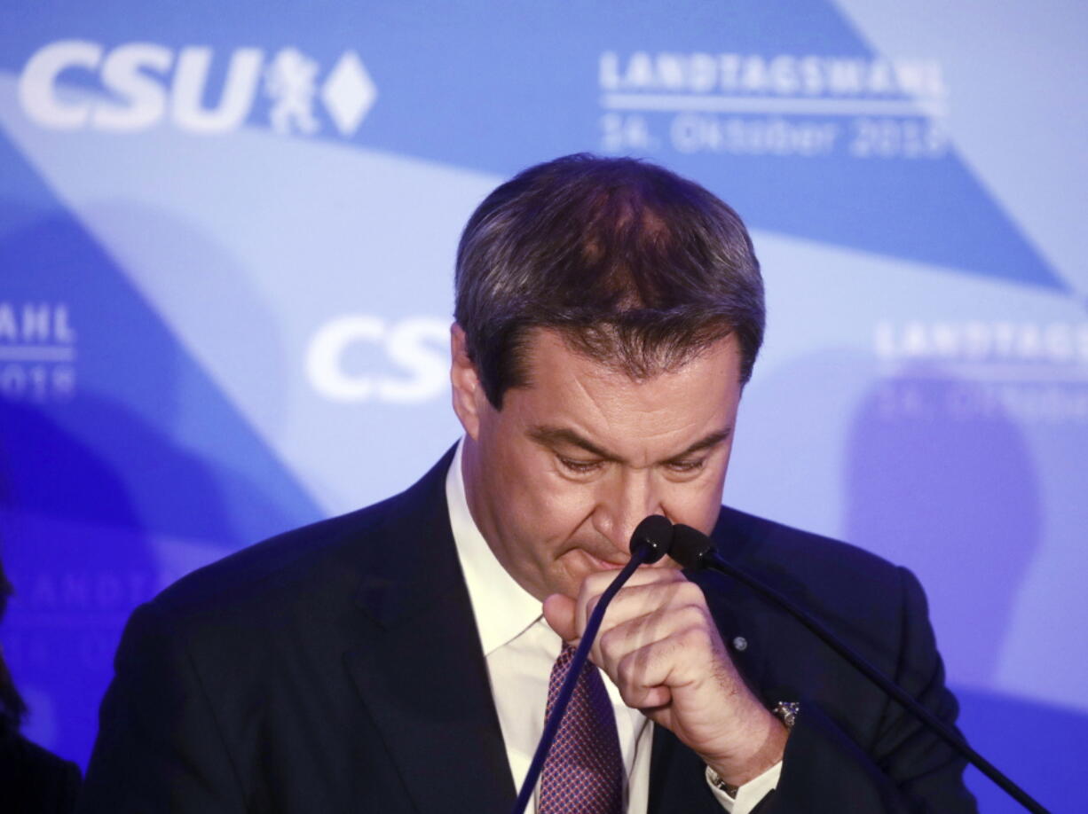 Bavarian governor Markus Soeder reacts during his first appearance after the first exit polls for the Bavarian state election in Munich, southern Germany, Sunday, Oct. 14, 2018.