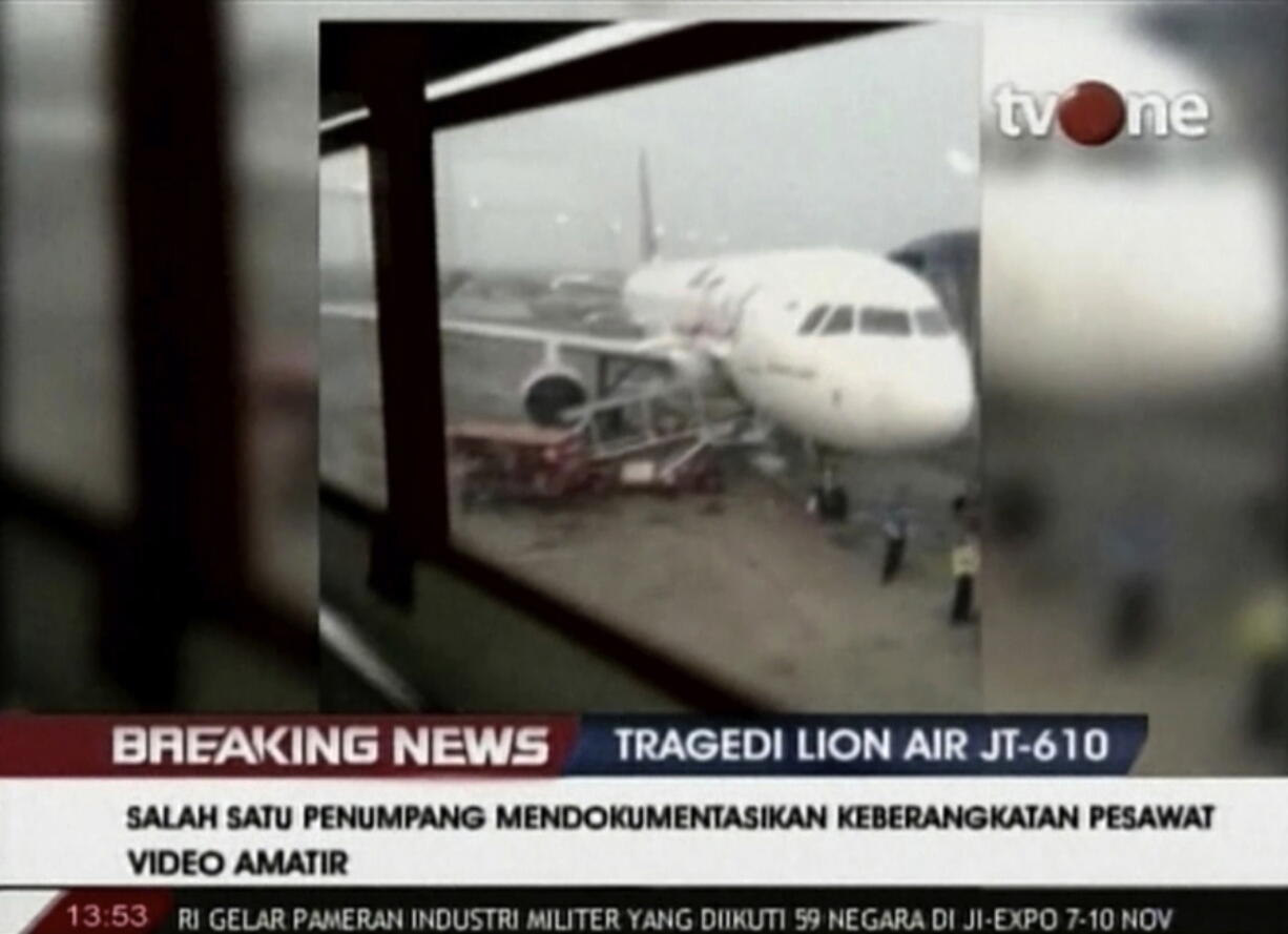 In this Oct. 29, 2018 image from video provided by Inchy Ayorbaba shows footage from her husband, Paul Ferdinand Ayorbaba, of passengers boarding Lion Air Flight 610 on Oct. 29, in Jakarta. The mundane details in a smartphone video show the last images of some of the 189 people who perished onan Indonesian Lion Air flight a little more than an hour after the video was shot.