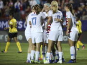 Teammates celebrate after United States midfielder Julie Ertz (facing camera) scored a goal during the first half of a CONCACAF women’s World Cup qualifying tournament soccer match in Frisco, Texas, Sunday, Oct. 14, 2018.