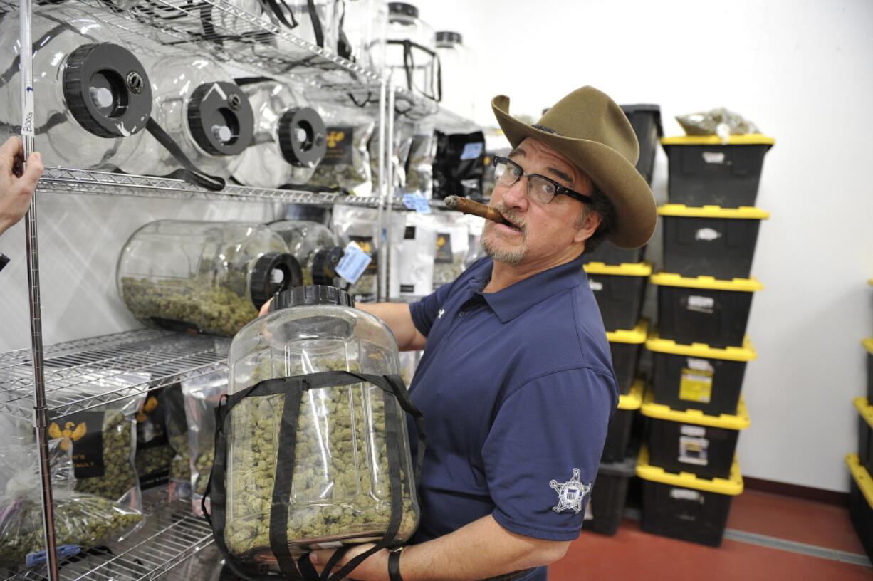 In this Monday, Oct. 15, 2018 photo, Jim Belushi tours his pot farm on the Rogue River near Eagle Point, Ore. Jim Belushi has a lifetime of memories shaped by cannabis. The famous actor, singer and community supporter describes a spiritual connection to the marijuana he’s growing on his 93-acre spread near Eagle Point, known as the Belushi Farm, and its 22,000-square-foot state licensed grow.