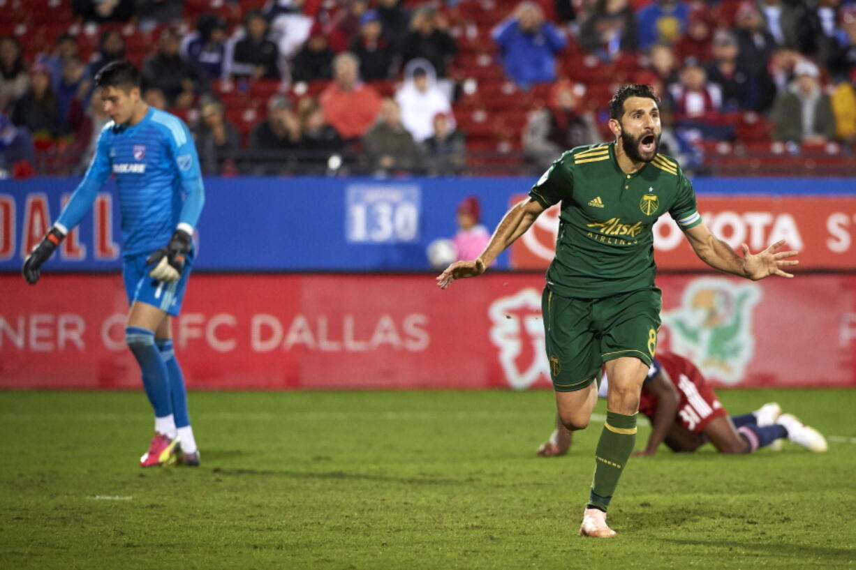 Portland Timbers midfielder Diego Valeri (8) celebrates after scoring a goal against FC Dallas during the second half of an MLS soccer playoff match in Frisco, Texas, Wednesday, Oct. 31, 2018.