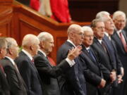 The Church of Jesus Christ of Latter-day Saints President Russell M. Nelson, center, greets the twice-annual conference of The Church of Jesus Christ of Latter-day Saints Saturday, Oct. 6, 2018, in Salt Lake City. Mormon leaders delivered spiritual guidance and church news as the faith's conference kicks off in Salt Lake City one day after the faith announced it was renaming the famed Mormon Tabernacle Choir to drop the word Mormon.