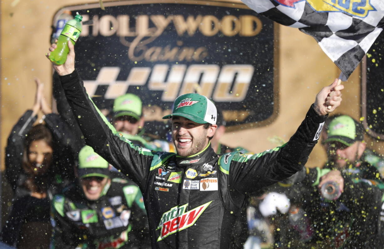 Chase Elliott celebrates winning a NASCAR Cup Series auto race at Kansas Speedway in Kansas City, Kan., Sunday, Oct 21, 2018. (AP Photo/Colin E.