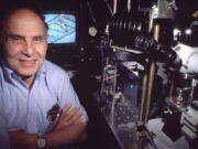 American scientist Arthur Ashkin at a lab in Holmdel, N.J., in a 1988 file photo.