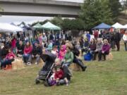 Old Apple Tree Festival attendees take in a performance by Portland-based ragtime band The Juleps on Saturday at Vancouver’s Old Apple Tree Park.