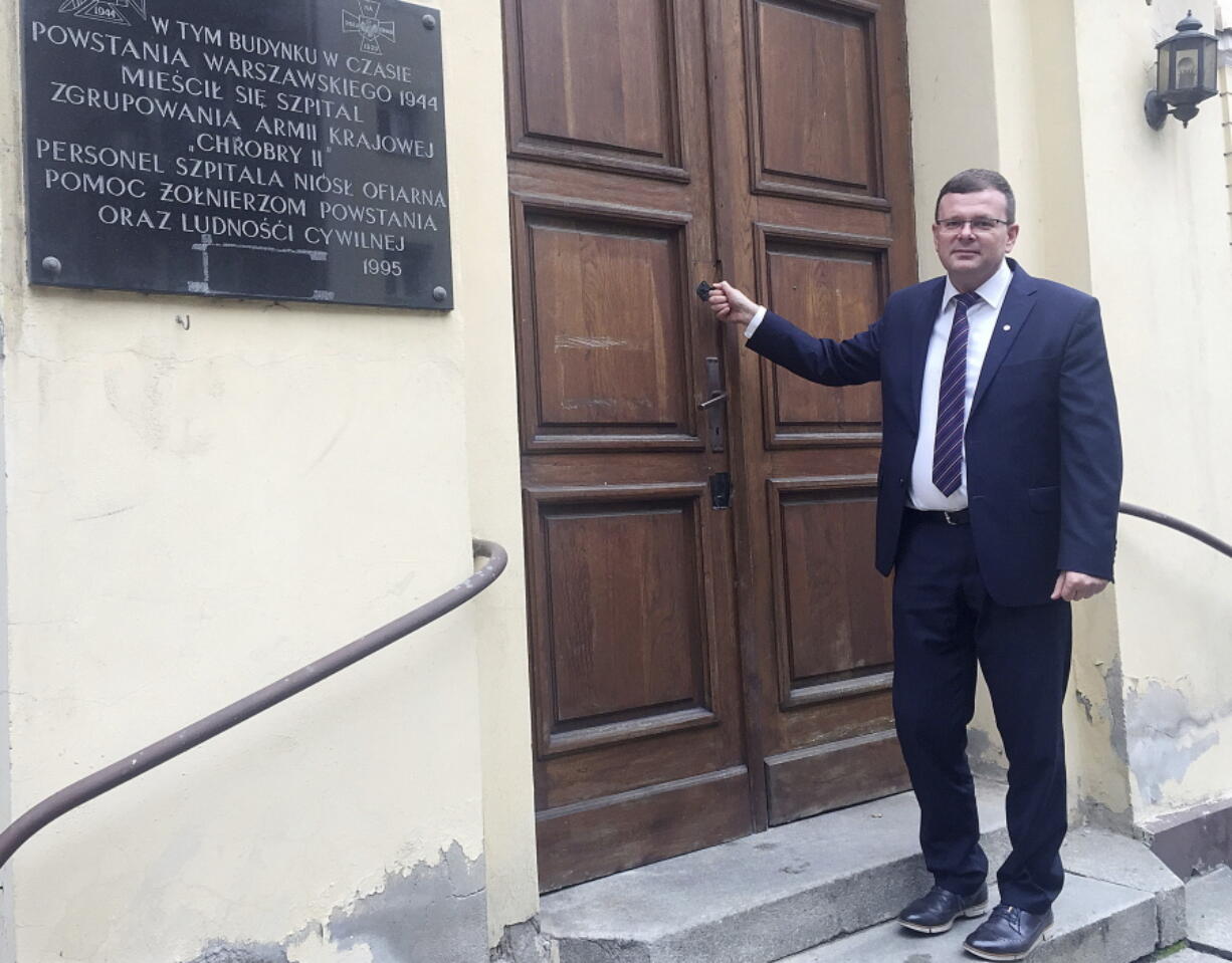 Albert Stankowski, director of the Warsaw Ghetto Museum, stands in front of the former hospital in Warsaw, Poland, that will house the museum.