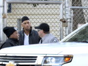 Former Carolina Panthers NFL football player Rae Carruth, center, exits the Sampson Correctional Institution in Clinton, N.C., on Monday. Former NFL wide receiver Rae Carruth has been released from prison after serving 18 years for conspiring to murder the mother of his unborn child. The Carolina Panthers’ 1997 first-round draft pick was released Monday from Sampson Correctional Institution in Clinton, North Carolina after completing his sentence.