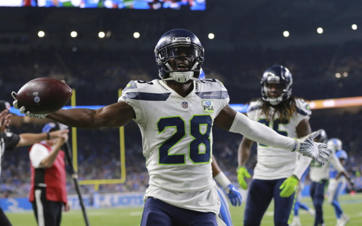 Seattle Seahawks cornerback Justin Coleman (28) reacts after interception a pass at the goal line intended for Detroit Lions wide receiver Golden Tate during the second half of an NFL football game, Sunday, Oct. 28, 2018, in Detroit.