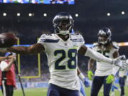 Seattle Seahawks cornerback Justin Coleman (28) reacts after interception a pass at the goal line intended for Detroit Lions wide receiver Golden Tate during the second half of an NFL football game, Sunday, Oct. 28, 2018, in Detroit.