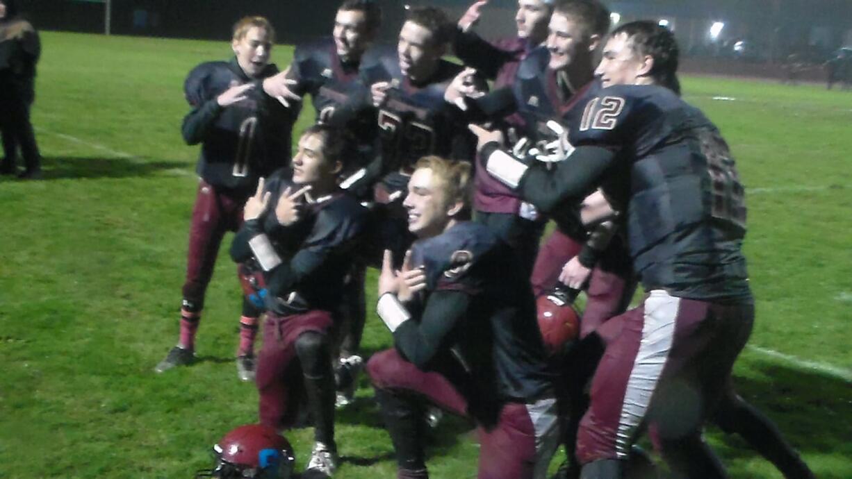 Stevenson football pose in celebration after beating La Center 27-21 on Friday (Tim Martinez/The Columbian)