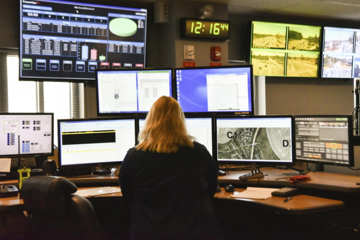 A dispatcher works in March with a variety of screens used by those who take 911 emergency calls in Roswell, Ga. The Roswell call center is one of the few in the United States that accepts text messages.