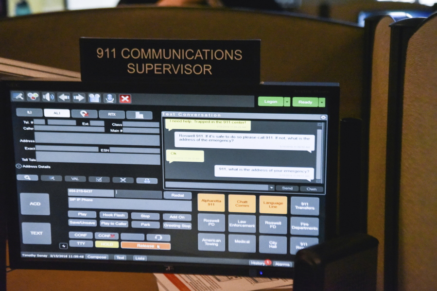 FILE- This March 15, 2018, file photo shows a 911 call center in Roswell, Ga., with one of the computer screens used by dispatchers shows a text message that has come into the system. The Roswell call center is one of the few in the United States that accepts text messages. Most places in the U.S. don’t have access to text-to-911 services, an increasingly crucial gap during an era of mass shootings and other catastrophes, when a phone call is not always an option.