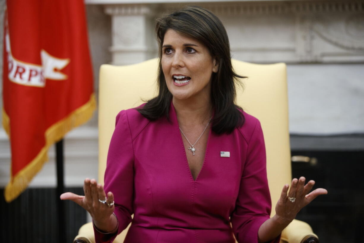 Outgoing U.S. Ambassador to the United Nations Nikki Haley speaks during a meeting with President Donald Trump in the Oval Office of the White House on Tuesday in Washington.