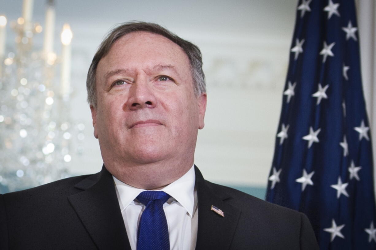 Secretary of State Mike Pompeo meets Pakistani Foreign Minister Makhdoom Shah Mahmood Qureshi at the State Department in Washington on Tuesday. Pompeo is heading back to North Korea for another round of talks aimed at getting Kim Jong Un to give up nuclear weapons.