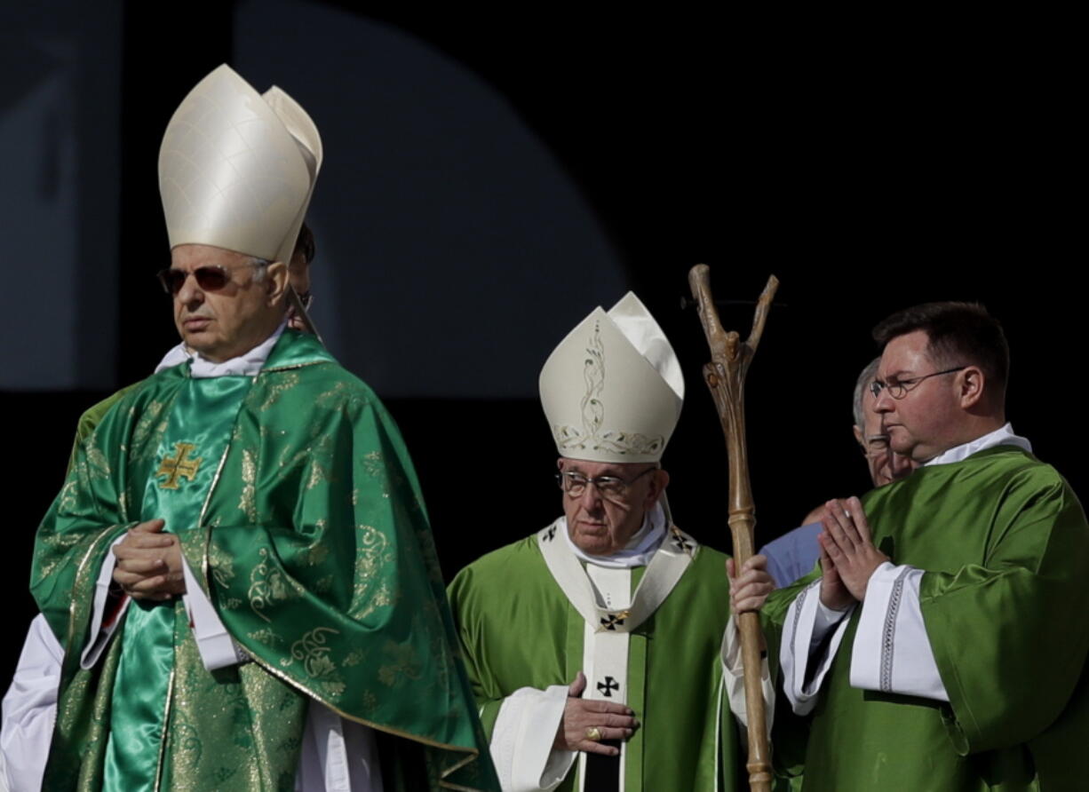 Pope Francis, center, arrives to celebrate a Mass for the opening of a synod, a meeting of bishops, in St. Peter’s Square, at the Vatican, Wednesday, Oct. 3, 2018. The synod is bringing together 266 bishops from five continents for talks on helping young people feel called to the church at a time when church marriages and religious vocations are plummeting in much of the West.