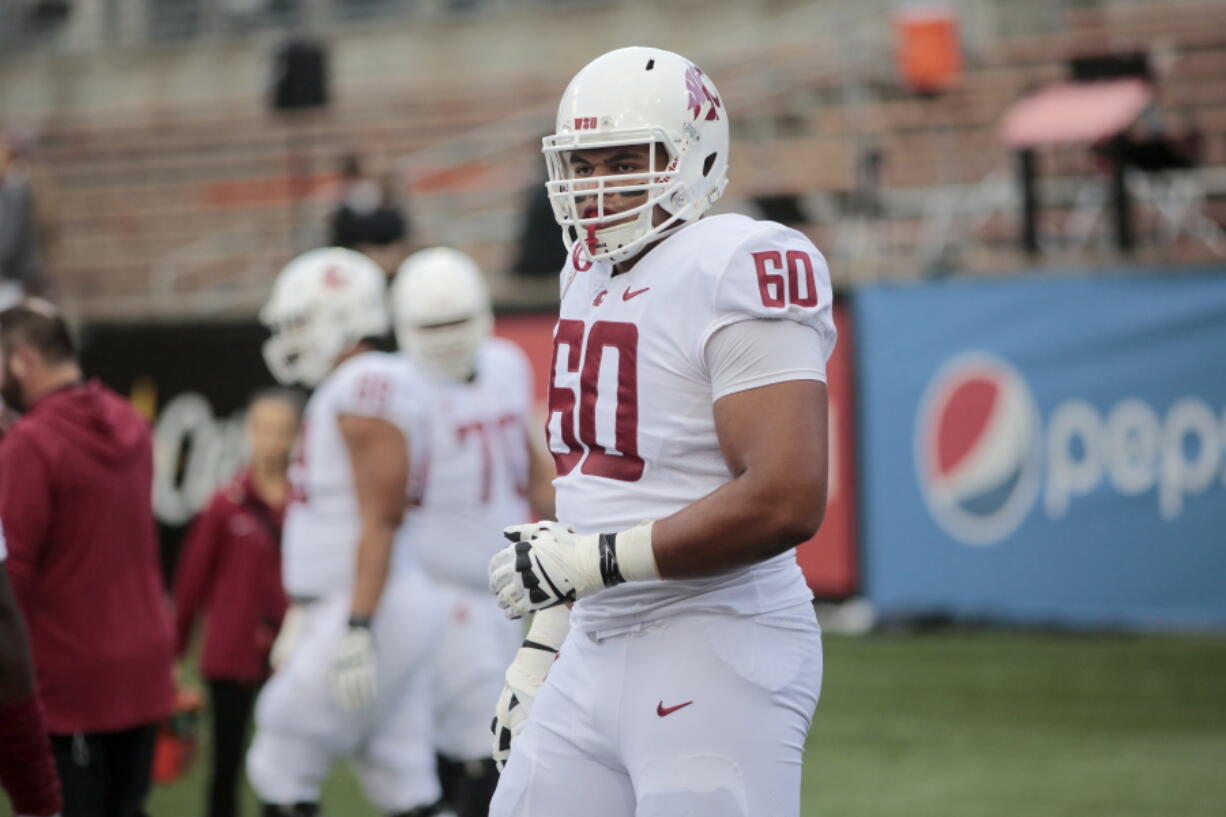 Washington State's Andre Dillard (60) before an NCAA college football in Corvallis, Ore., on Saturday Oct. 6, 2018. (AP Photo/Timothy J.