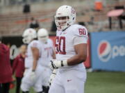 Washington State's Andre Dillard (60) before an NCAA college football in Corvallis, Ore., on Saturday Oct. 6, 2018. (AP Photo/Timothy J.