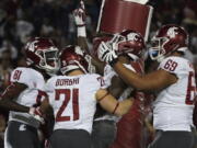 Washington State wide receiver Davontavean Martin, second from right, celebrates a touchdown in the second half against Stanford during an NCAA college football game on Saturday, Oct. 27, 2018, in Stanford, Calif.