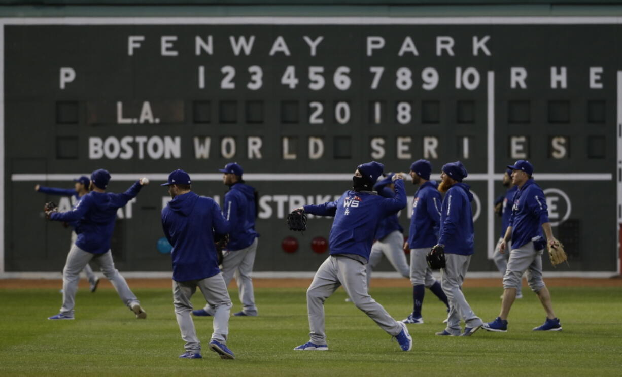 Los Angeles Dodgers’ players practice for Game 1 of the World Series baseball game against the Boston Red Sox Monday, Oct. 22, 2018, in Boston.