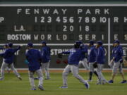 Los Angeles Dodgers’ players practice for Game 1 of the World Series baseball game against the Boston Red Sox Monday, Oct. 22, 2018, in Boston.