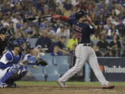 Boston Red Sox's Steve Pearce watches his solo home run to tie the game during the eighth inning in Game 4 of the World Series baseball game against the Los Angeles Dodgers on Saturday, Oct. 27, 2018, in Los Angeles. (AP Photo/David J.