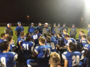 La Center coach John Lambert addresses his Wildcats moments after a 48-14 win over Seton Catholic at La Center High School on Friday, Oct. 12, 2018.