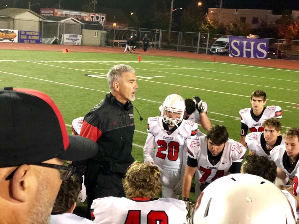 Camas coach Jon Eagle addresses his team in the moments after losing 14-7 to Sumner at Sunset Chev Stadium on Thursday, Oct.