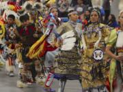 Dancers perform Saturday during the Grand Entry at the 19th annual Cowlitz Pow Wow at the Clark County Event Center at the Fairgrounds.