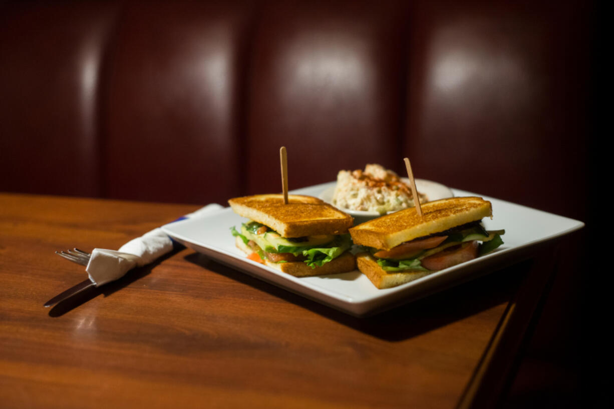 The SLAB.L.T. sandwich with potato salad at Shelby’s Grille in Washougal.