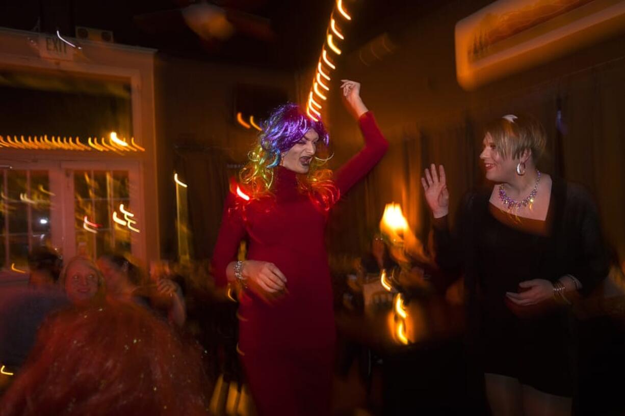 High school student Keegan Dittmer, left, brings Wanda Faame to life while greeting a fellow drag queen at Brickhouse Bar & Grill last spring. Dittmer is ready to launch the next season of QWERKY, a queer variety show, tonight at Columbia River High School.