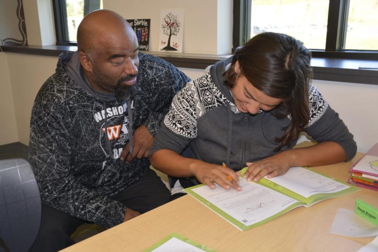 Washougal: Isaac Brown, left, and Aryanna Albright read together during “Bring Your Parent to School Day” at Jemtegaard Middle School.