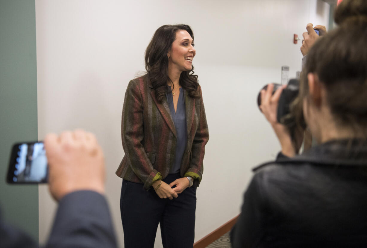 Incumbent U.S. Rep. Jaime Herrera Beutler, R-Battle Ground, talks with the media at the Clark County Public Service Center Tuesday evening after hearing initial results placing her in the lead.