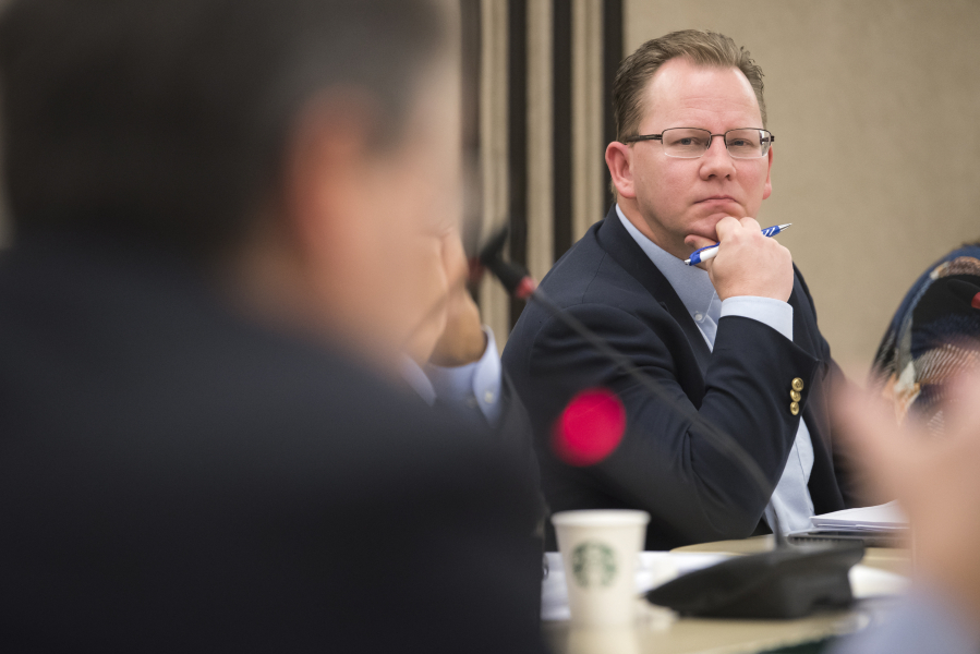 Superintendent of Public Instruction Chris Reykdal listens to a member of the Washington State Board of Education speak in 2018 at Educational Service District 112 in Vancouver.