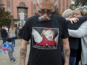 Tim Luchau, grandfather of Hartley Anderson, wears a t-shirt in her honor as loved ones gather on the steps at the Clark County Courthouse following the first appearance of Ryan M. Burge on Monday morning, Nov. 5, 2018.