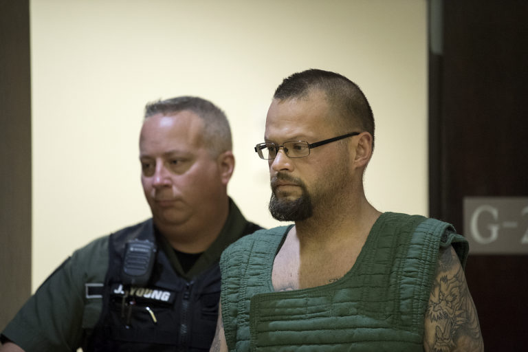 Ryan M. Burge, right, leaves the courtroom after making a first appearance on suspicion of murder in the death of a 5-year-old in Clark County Superior Court on Monday morning, Nov. 5, 2018.