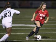 Camas' Callie Rheaume (2) dribbles downfield during the first round of the 4A state playoffs at Doc Harris Stadium in Camas on Wednesday, Nov. 7, 2018. Camas won 1-0.