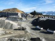 Mining basalt rock is a heavy-duty business. At the Yacolt Mountain Quarry, trucks, frontloaders and other big machines move in-demand rock to market.