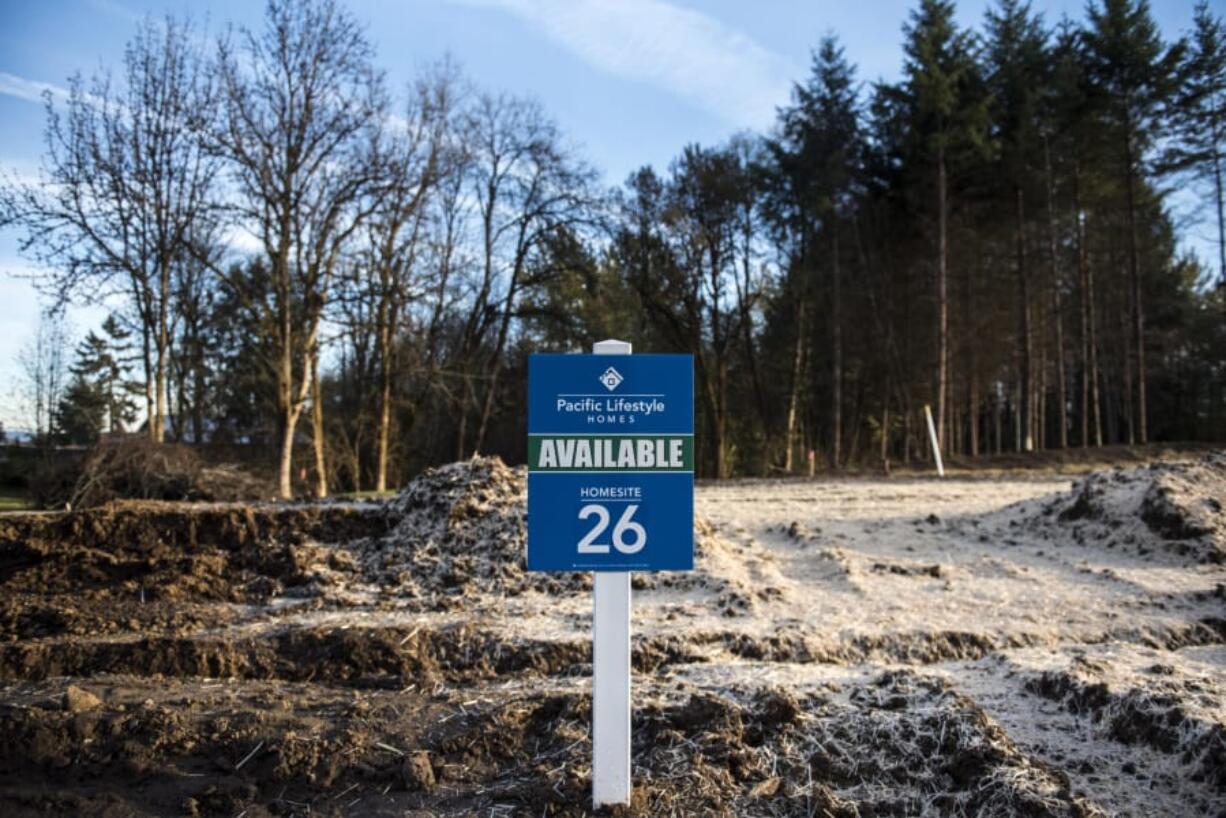 A sign adverting an available homesite is seen here at the Amberglen development on Monday afternoon, Nov. 12, 2018.