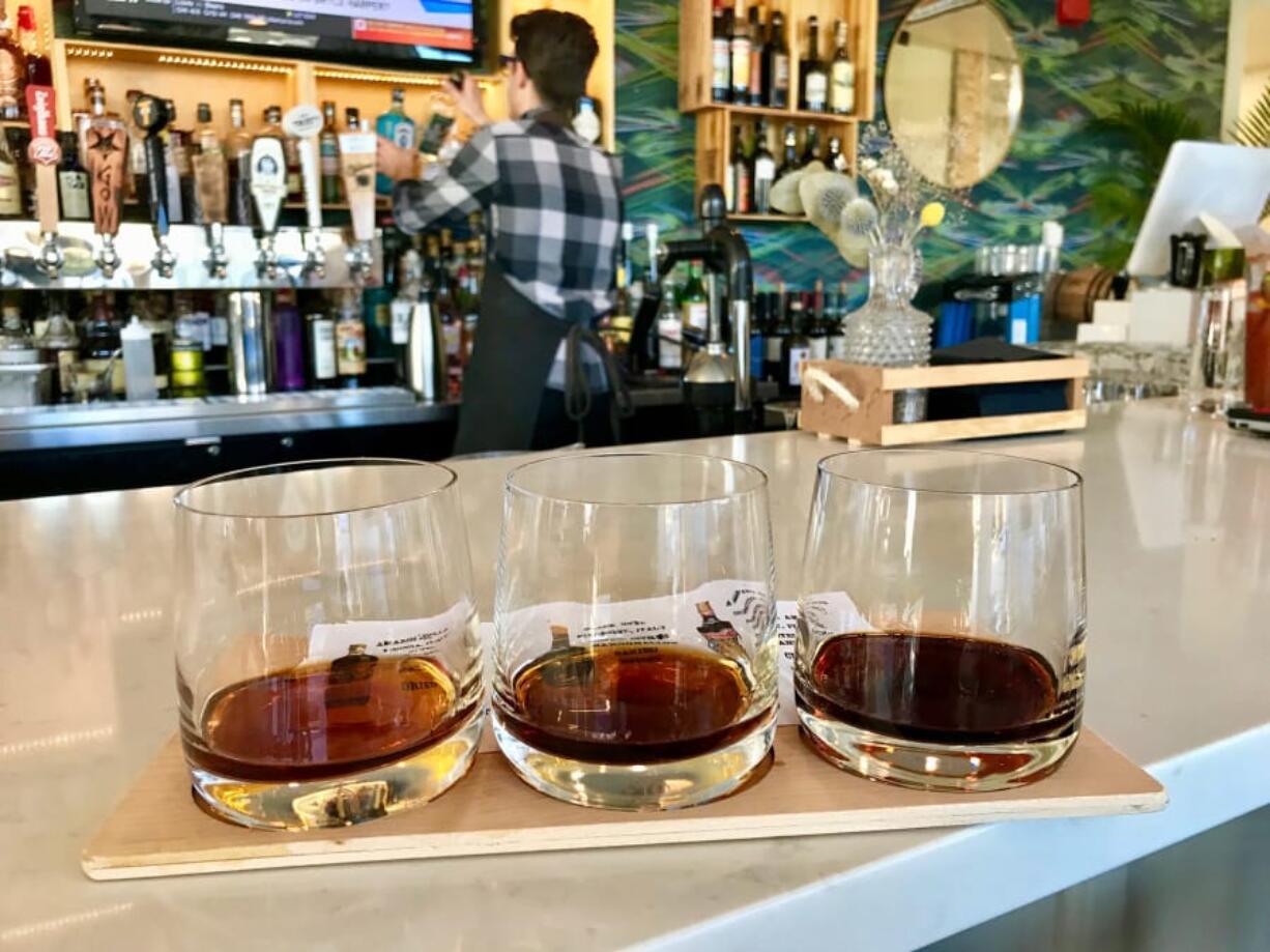 A flight of three amari await tasting at Amaro’s Table in downtown Vancouver.