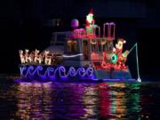 This is the Bubinga, piloted by Larry and Betty Aberg of Vancouver. The annual Christmas Ships Parade returns this year for its 64th season of lighting up local rivers at night. This year, Vancouver’s spiffy new waterfront and pier should provide great viewing for spectators.