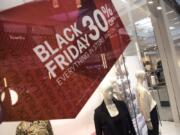 A Black Friday sale sign hangs at Vancouver Mall on Monday.