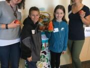 Central Park: Washington State University Extension’s Supplemental Nutrition Assistance Program Education’s Kristine Perry, from left, with Mill Plain Elementary School’s Madi Evin and Connor Stratton and Anna Weyrauch, also from WSU.